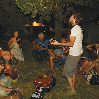 Campers gather for a jam session at Woody Fest