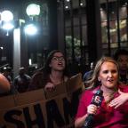 Protesters gather outside the entrance to the Mayo Hotel in downtown Tulsa calling for the staff to “Bring out the Murderer” and shouting “No Justice, No peace” along with “Hands up, Don't shoot.”