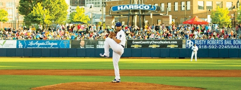 Chris Anderson delivers the first pitch of the ‘16 season at ONEOK Field