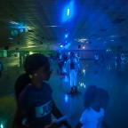 Neon lights, a huge disco ball, smoke machines and wall murals add to the romance and fun of Skateland.