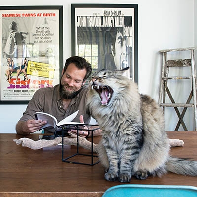 Christopher Long and his cat, Ender