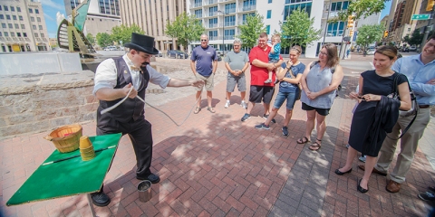 Capstone the Magician performing downtown for Tours of Tulsa