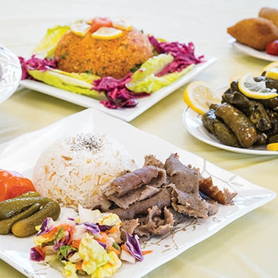 Volunteers from the Raindrop Womens Association make the food for the Turkish Food and Art Festival, including couscous salad, baklava, and crystal cookies with Nutella.