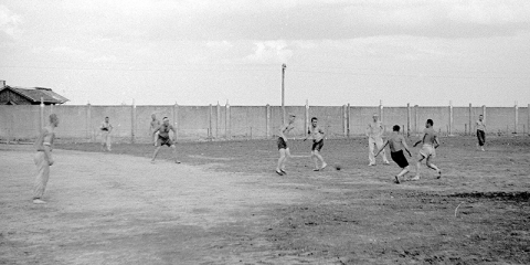 Nazi propaganda photo of prisoners playing at KZ-Dachau, June 10, 1933