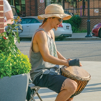 A busker in the Brady Arts District