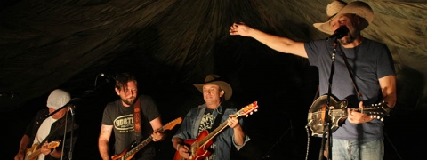 Dustin Pittsley (second from left) sits in with the Red Dirt Rangers at Stone River Music Festival in 2013. 