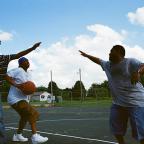 Guys play basketball at O’Brien Park