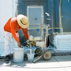 A man works on 11th Street near South Quincy Avenue