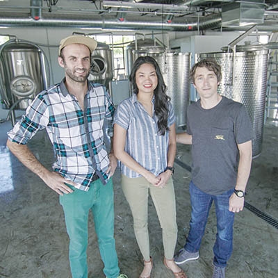 Jake Miller, Melissa French, and Zach French in the Heirloom Rustic Ales brewery