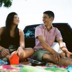 Littie and Landon picnic in the back of a pick-up at the 41st Street River Parks plaza