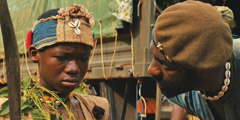 Abraham Attah and Idris Elba in “Beasts of No Nation”