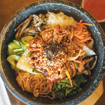 Spicy chicken bibimbap at Sura