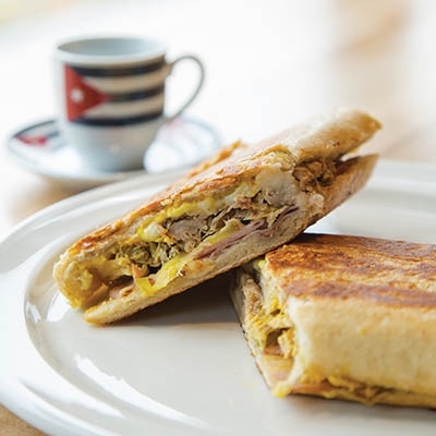 Mangos’ Cuban recipe is strictly Miamian and consists of layers of ham, Swiss cheese, pickles, mustard, and pork.