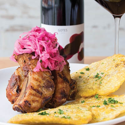 Costillas - chili-rubbed baby back ribs served with fried plantains