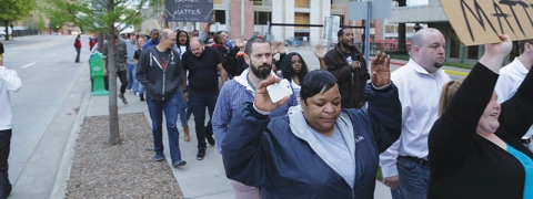 Protesters march toward the Tulsa County Sheriff’s Office  // Photo by Matt Phipps