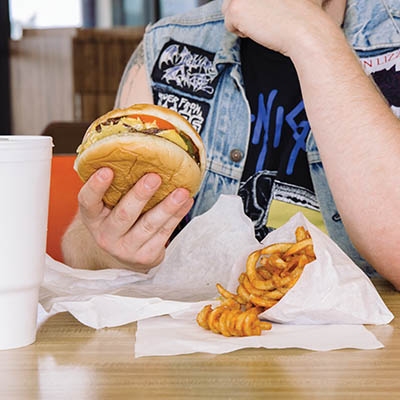 Lot-A-Burger’s double cheeseburger with onions fried in