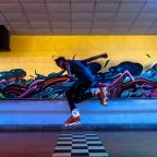 A roller blader leaps over the finish line at historic Skateland on Route 66 in Tulsa.