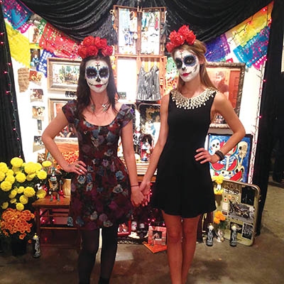 DeJon and Ashley Knapp with the shrine they built to their mother, 
Dee Wells, at the Dia de los Muertos celebration at Living Arts in 2013