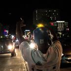 Protesters move to Denver Avenue, blocking traffic for about an hour on Wednesday night.